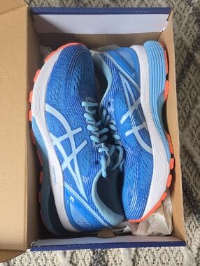 ASICS Women's Bright Blue Running Shoes with Orange Outsole Accents